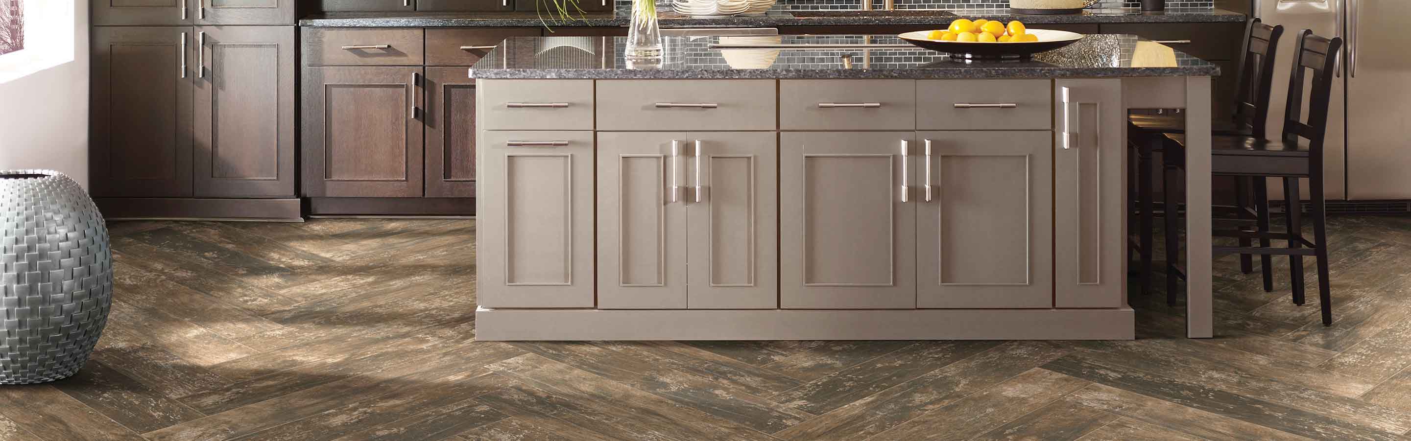 Dark herringbone tile in fancy kitchen. 